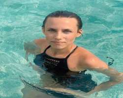 She is a skillful swimmer and enjoying swimming a lot.